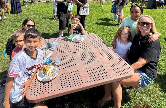 Families eating lunch at a table