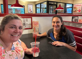 Two people enjoying a meal at a restaurant