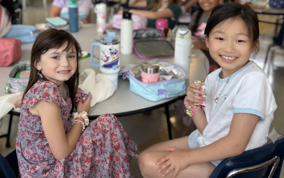 Two students enjoying lunch together on the first day of school