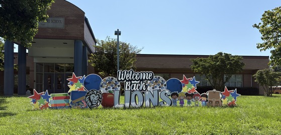 Welcome Back Lions sign in front of the school