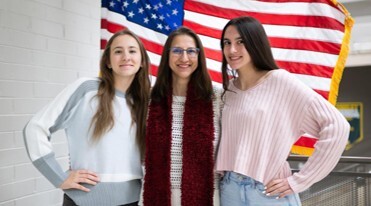 mom and daughters in a school