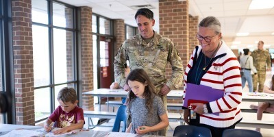 Dr. Reed with military family BBq