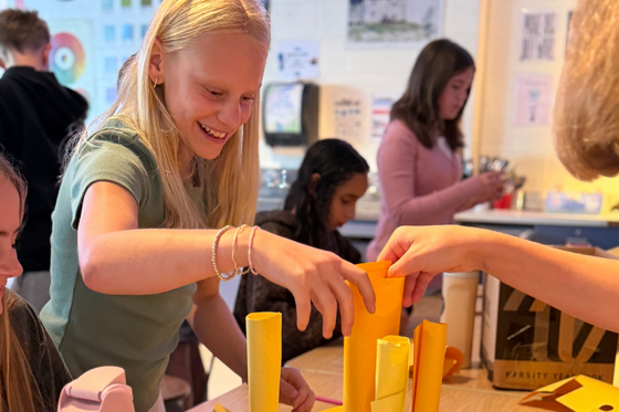 Students work together to build a colorful structure during a team-building activity in Ms. Kaseta’s art class on the first day of school.