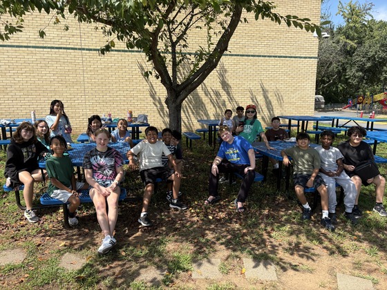 Sixth Graders at lunch outside.