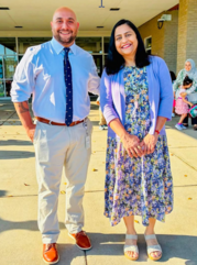 Mr. Marotta and Seema Dixit standing in front of Bull Run school smiling