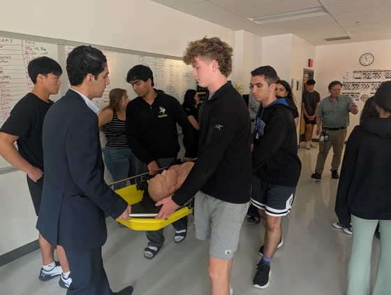 EMT students learn to lift and carry patients