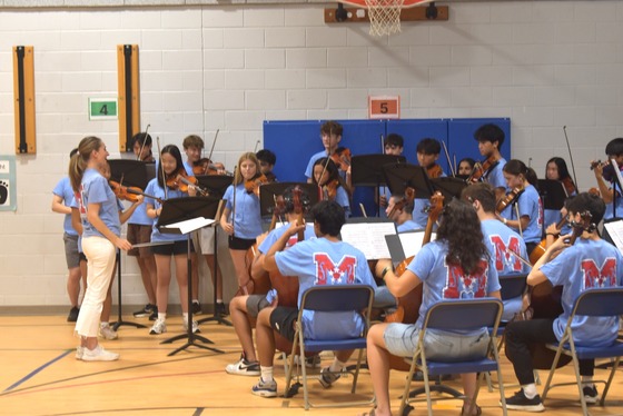 An assembly showcasing Marshall HS's strings ensemble to Stenwood students