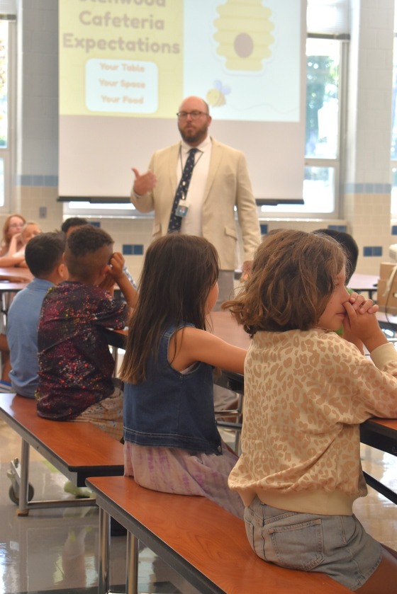 Mr. Case giving a presentation on cafeteria expectations to our students on the first day of school
