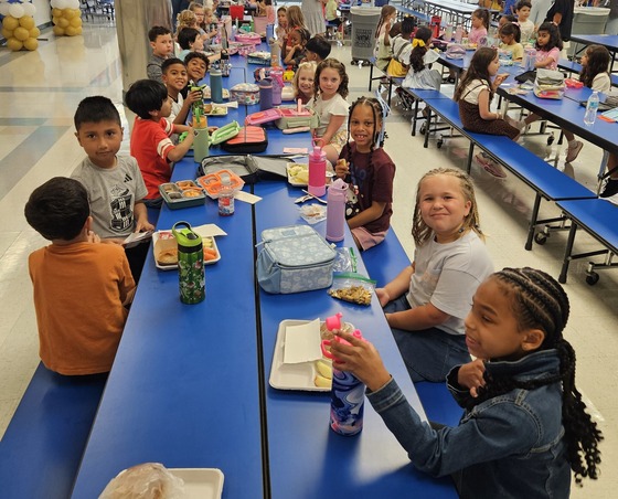 Mrs. Pradko's 2nd grade class sitting at their lunch table