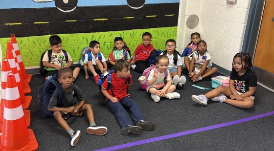 Preschoolers gathered in the hallway before school 