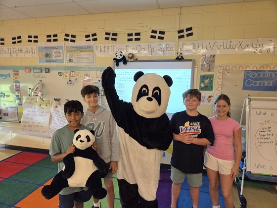 Our Morning News team visit the winning classroom for Friday Trivia with our school mascot Bamboo the Panda.