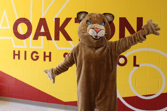 oakton cougar in front of mural
