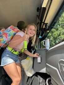 picture of student using bus ID to get on the bus