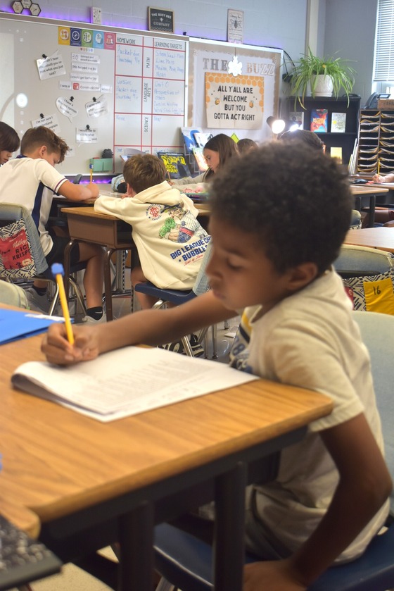 Image of a student working on classwork