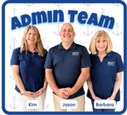 Admin Team standing with hands folded all wearing their Navy Logo blue shirts. Mrs. Seck, Mr. Pannutti and Mrs Gist are all smiling