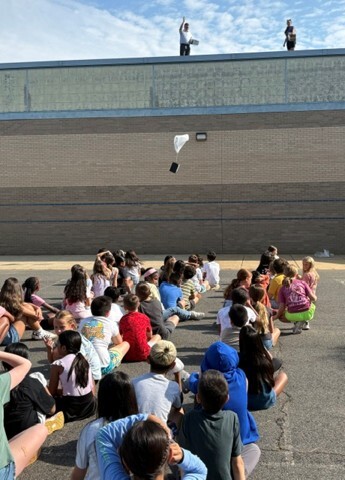 Mrs. Stough & Mr. Taylor dropped packages from the roof for the egg drop challenge.