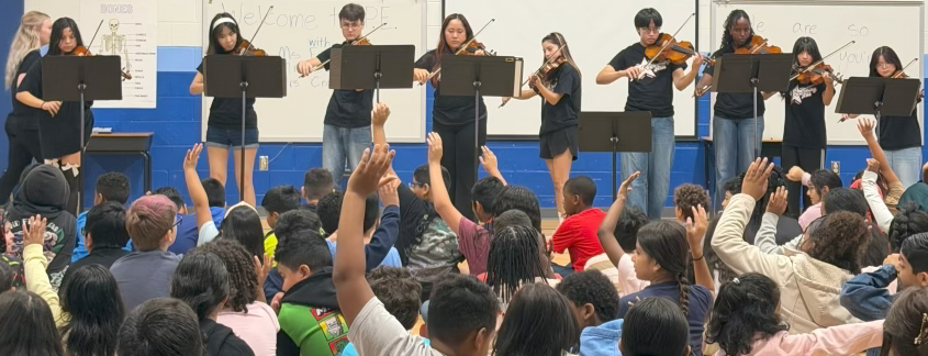 students performing at an elementary school