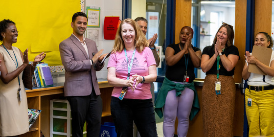 A teacher is applauded by FCPS and school leadership.