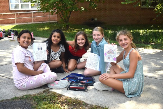 Five girls coloring at recess