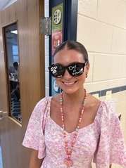 Photo of Ms. Carcone wearing first day of school sunglasses