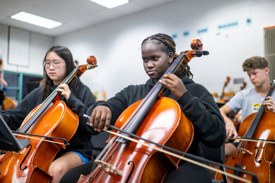 students practicing in orchestra class
