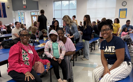 Families having breakfast at school