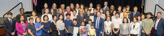 School Board Members with those in attendance for the proclamation honoring the 2Twenty club at the August 27th Board meeting.