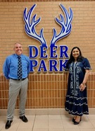 Principal D'Amato of Deer Park Elementary and Seema Dixit alongside the new sign created by ODI