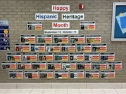 colorful pictures in a pyramid design on a brick wall