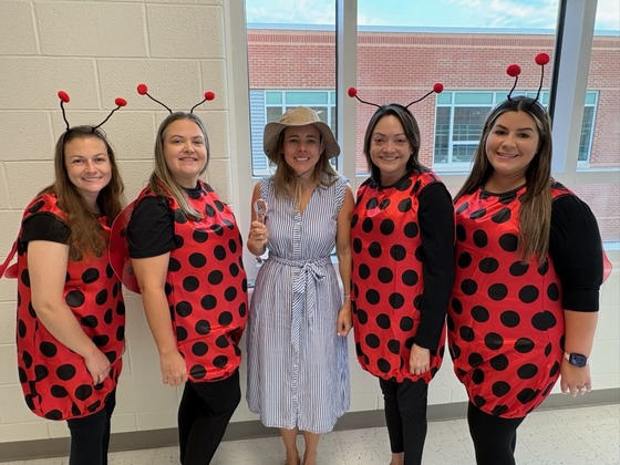 Teachers dressed as ladybugs for their ladybug science unit