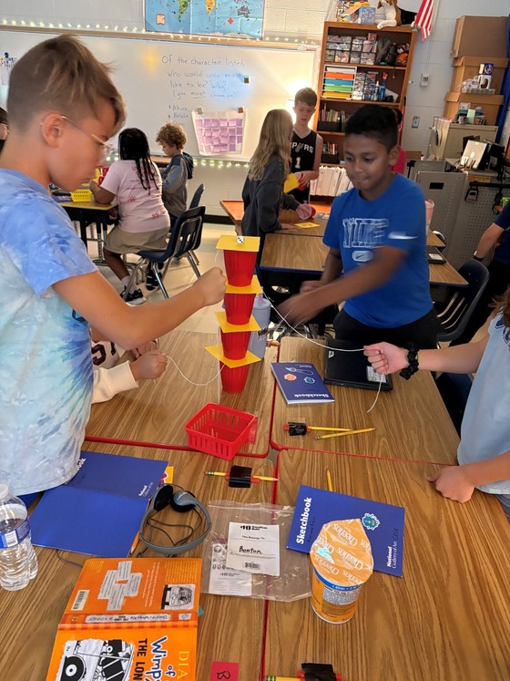 students conducting inertia experiments