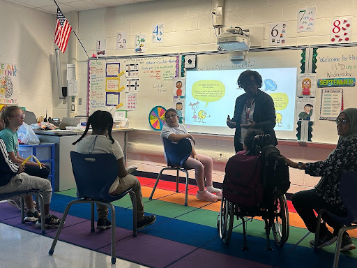 Mrs. Miser leading her class in a lesson about being Optimistic!