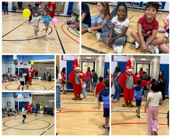 Elementary students play games and hug a red bird mascot during a school pep rally in a gymnasium.