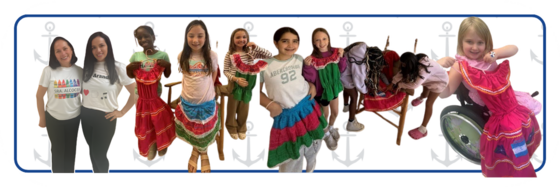 Image of students holding up hispanic cultural clothing