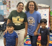 Kindergarten teacher, IA, and studetns showing AVID pride