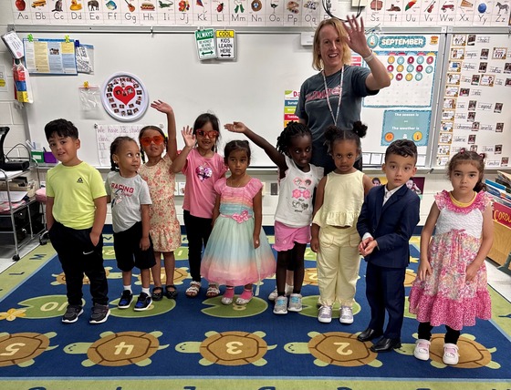 9 PK students dressed up in their AVID theme with their teacher