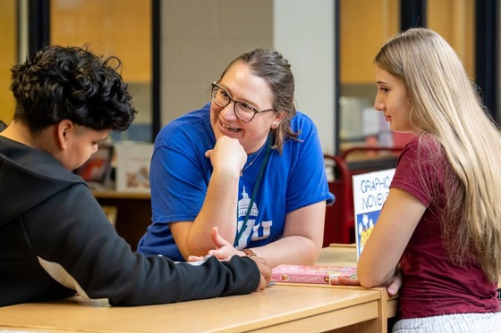teacher chatting with students