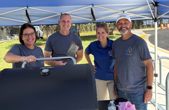 Admin and Mr. Collazo on the bbq for the staff bbq