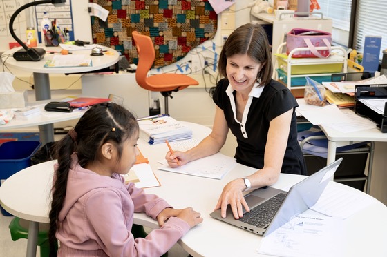 Teacher with student