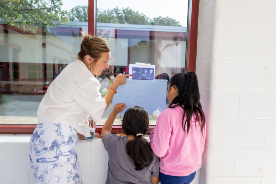 Students working with Mrs. Burk on a Chalk Talk about Ancient Egypt
