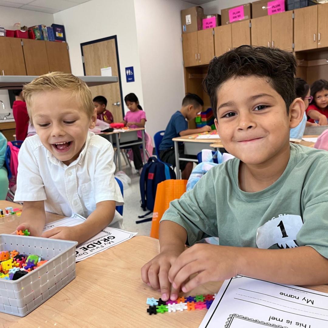Two students working on a my first day worksheet