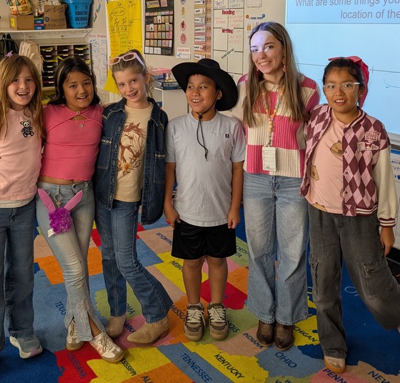 Students and teacher wearing pink for Dolly Parton Day