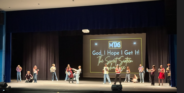 Students performing on a stage