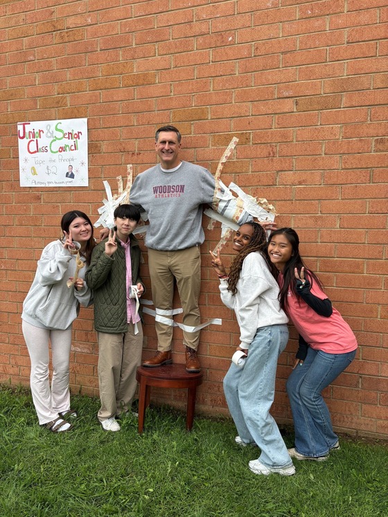 Mr. Greata taped to the wall by Junior and Senior class council