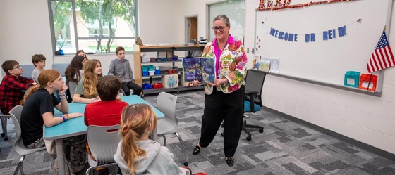 Dr. Reid reads to students