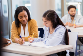 Adult helping a student
