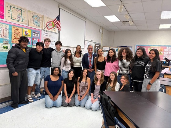 Image of students in a classroom with 2 adults