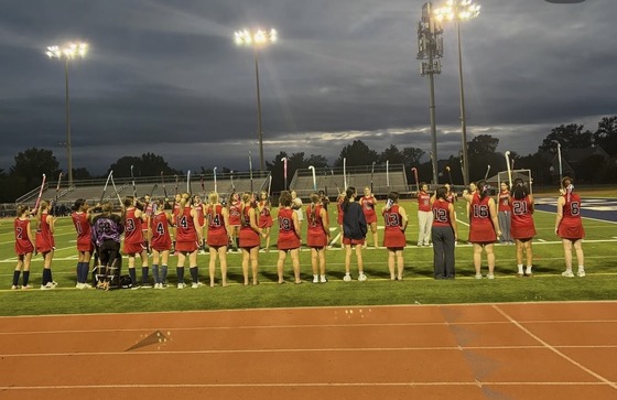 Girls standing on the football field