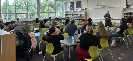 picture of principal with parents at a coffee meeting
