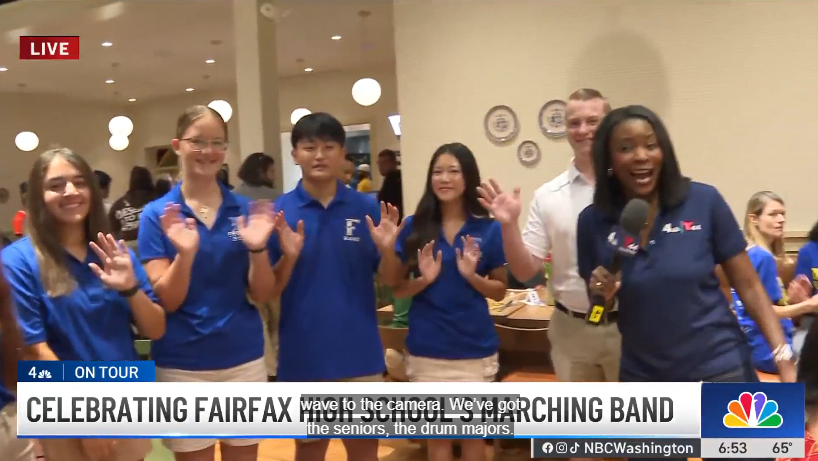 Students being interviewed by a news reporter